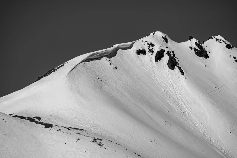 a snow covered mountain on a clear day