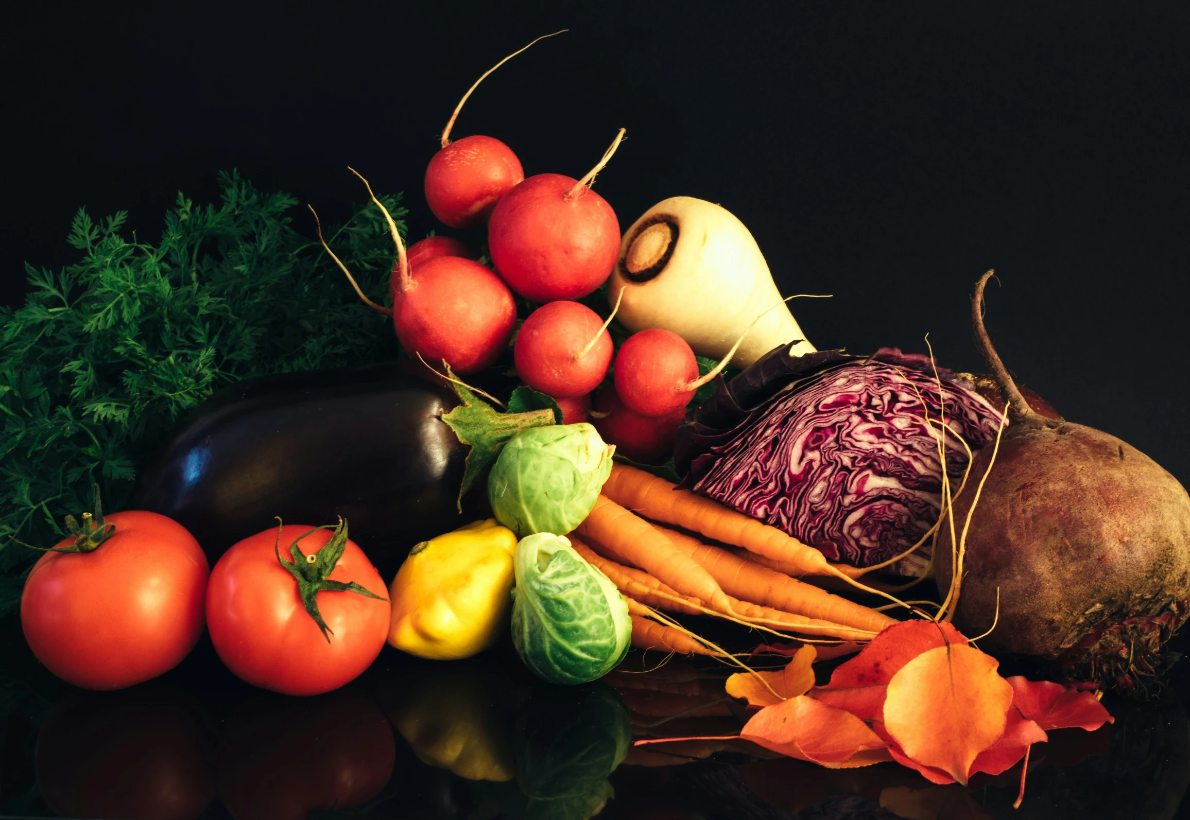 vegetables are arranged on a black surface