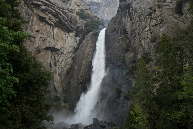 the side of a mountain with a waterfall