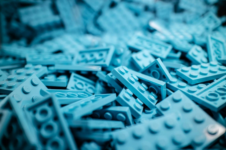 blue legos scattered around and about with a blurry background