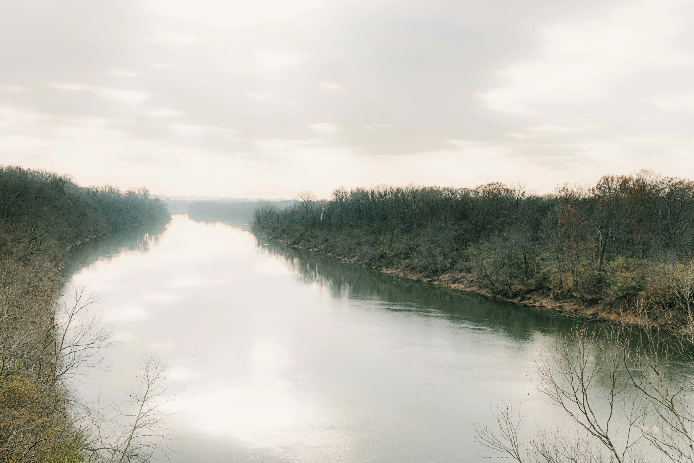 the river in the countryside is wide with water