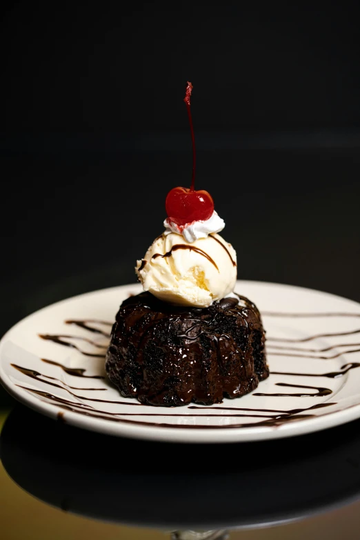 the dessert sits on a striped plate on the table