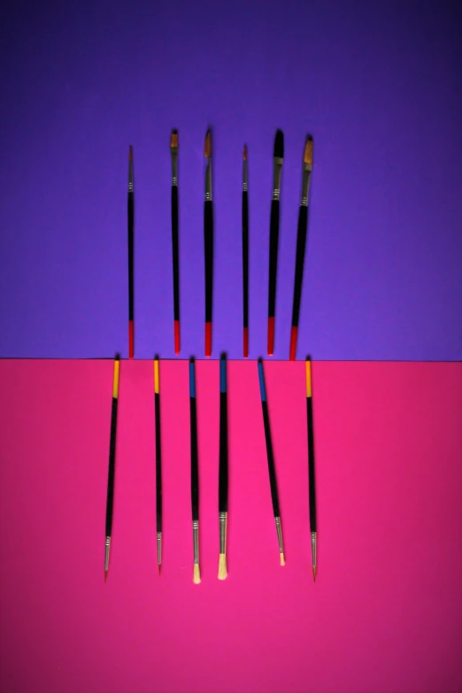 eight different types of makeup brushes sitting on a purple background