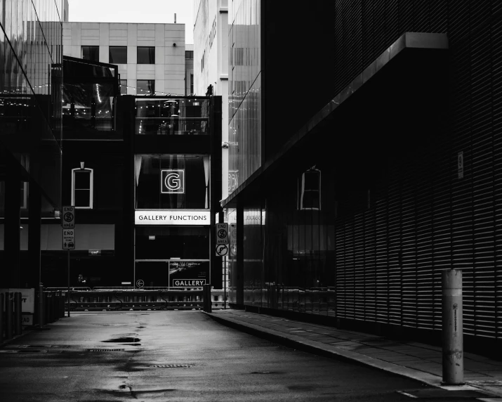 a black and white picture of the inside of an alley way