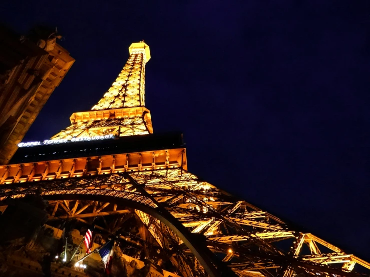 a lit up eiffel tower lit up at night