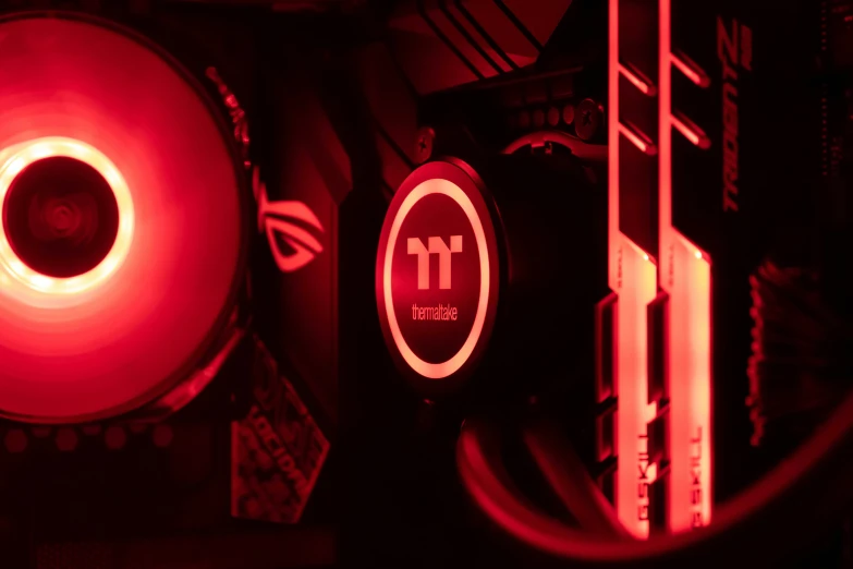 a close up of a red computer at night