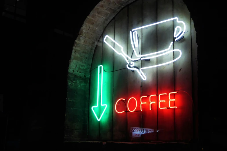 the neon coffee sign in the dark