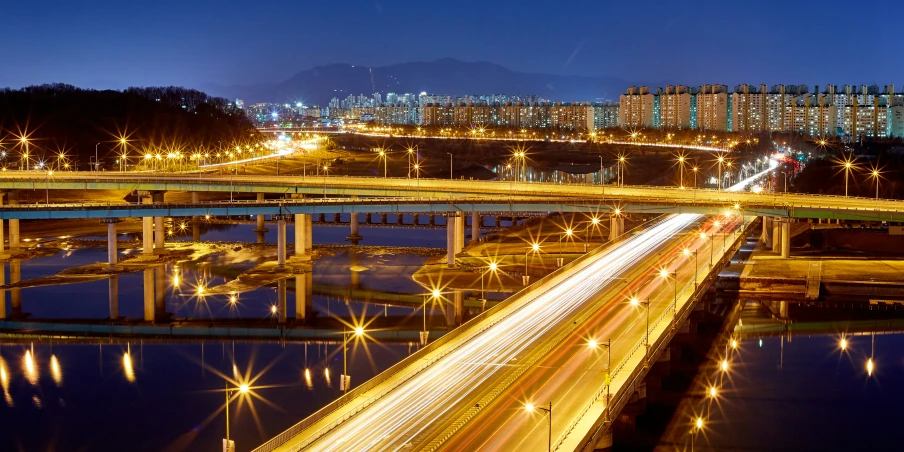 this is an aerial view of a bridge at night