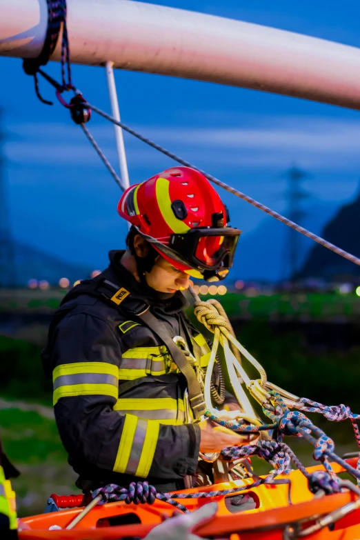 a firefighter checks on the wires on a fire truck