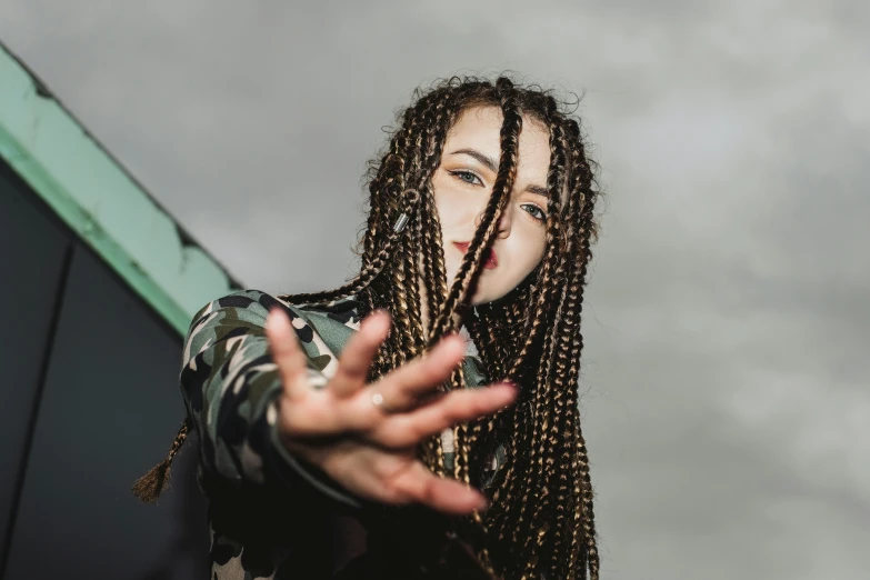 woman standing on the steps wearing dreadlocks