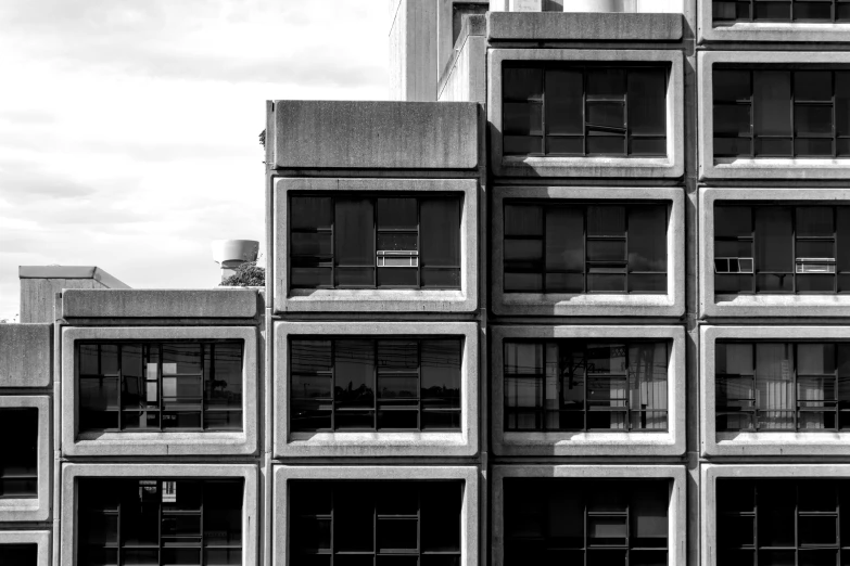 a large brick building next to tall buildings