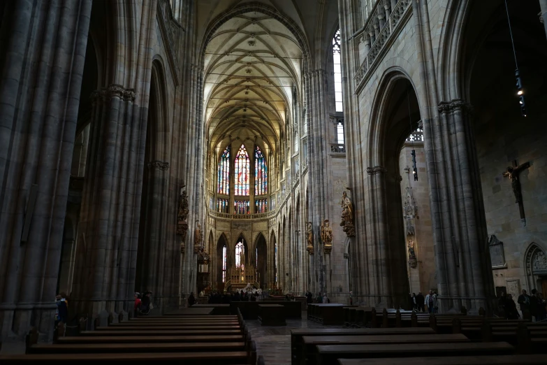 the large cathedral is lined with pews