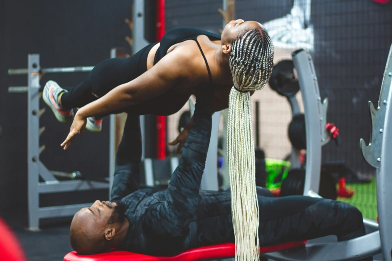 there is a man doing a handstand in a gym