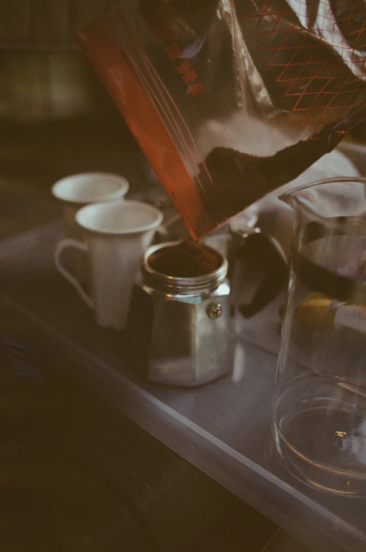 a person preparing coffee to use