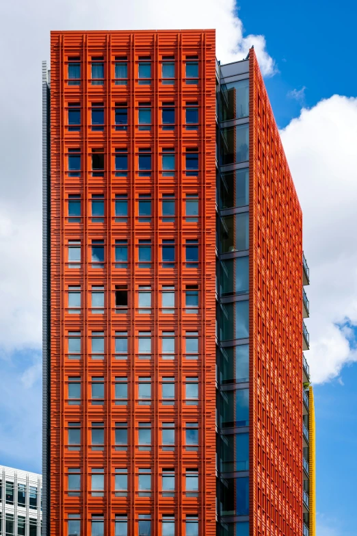 a orange building with lots of windows and no curtains