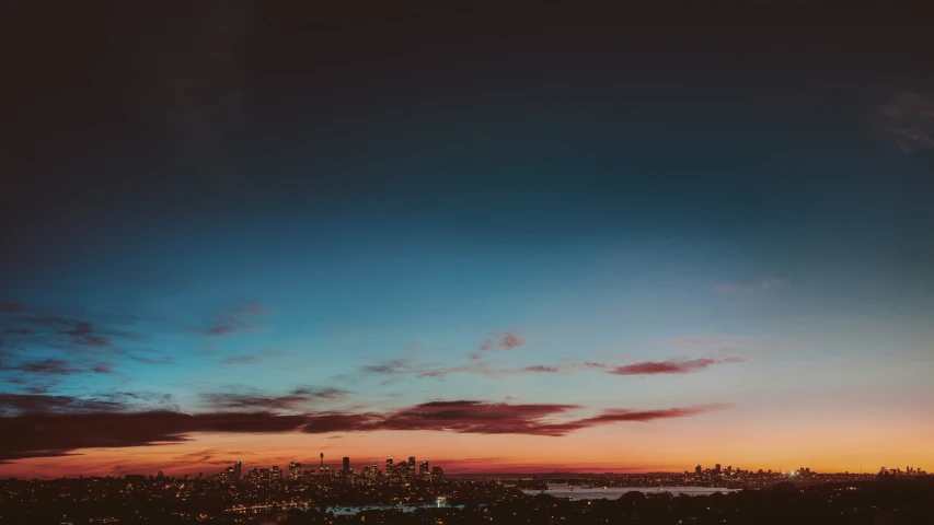 an image of the skyline of the city with clouds