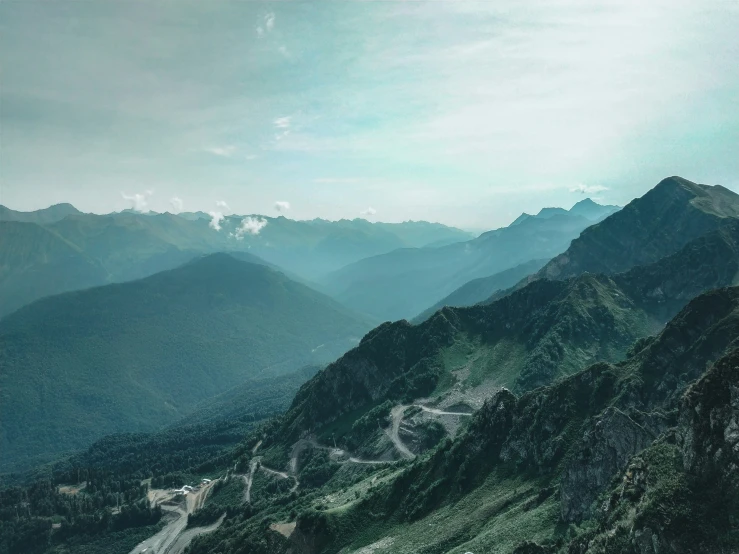 view of a winding road in a mountainous valley