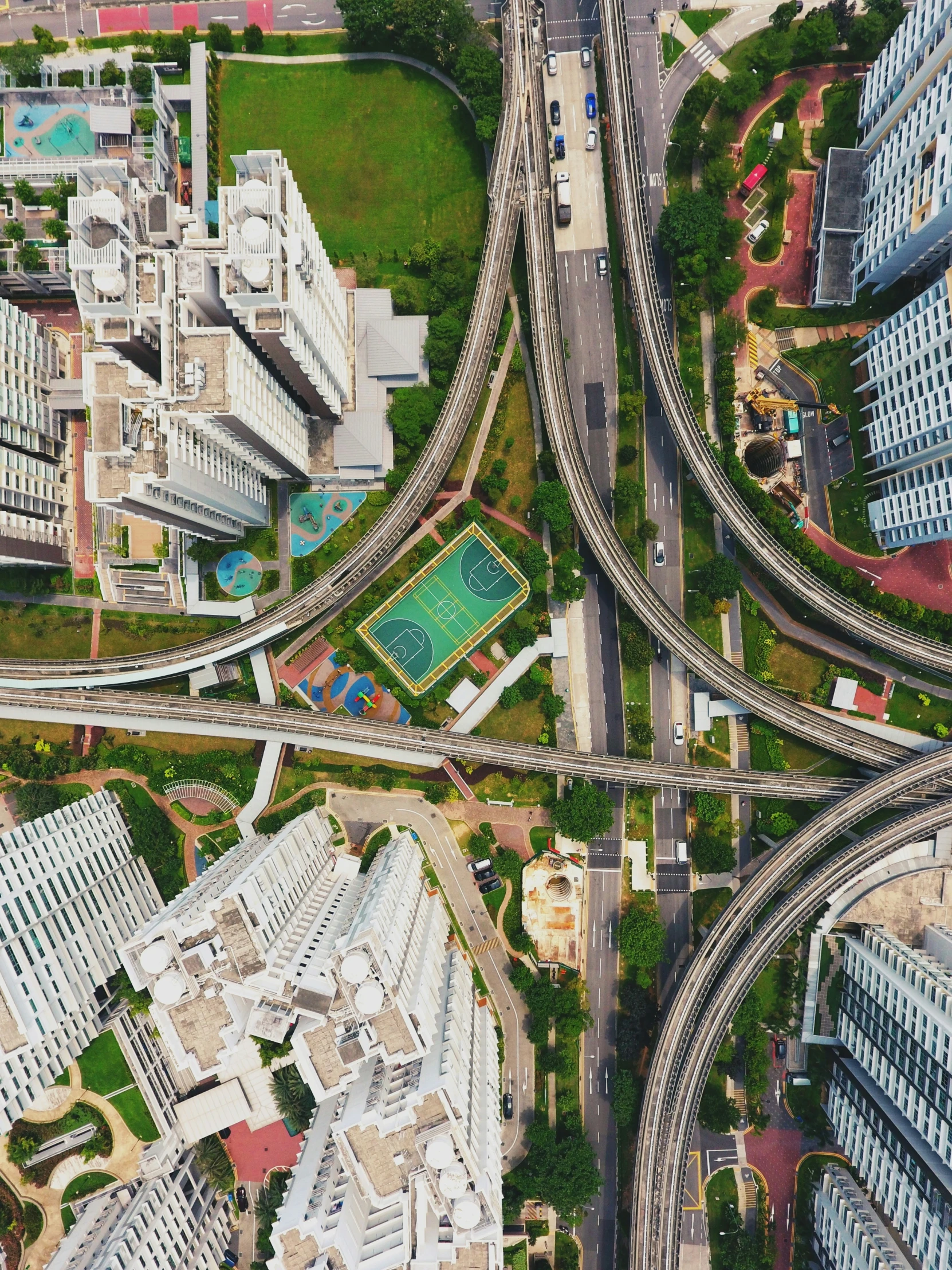 an aerial view of multiple roads in an open city