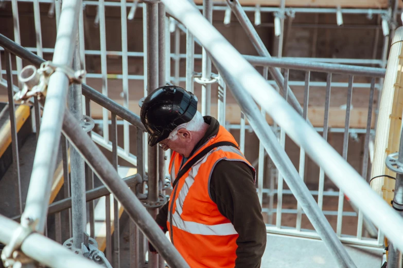 a man walking up steps at the bottom of some stairs