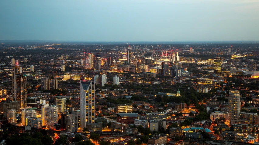 the city skyline at night, with lights on and over it