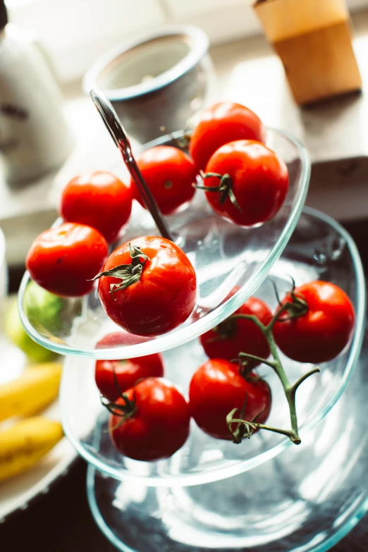 tomatoes on clear plates in the sun and a banana