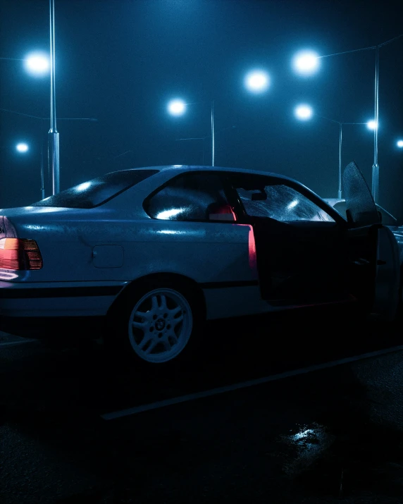 a white car parked in a parking lot at night