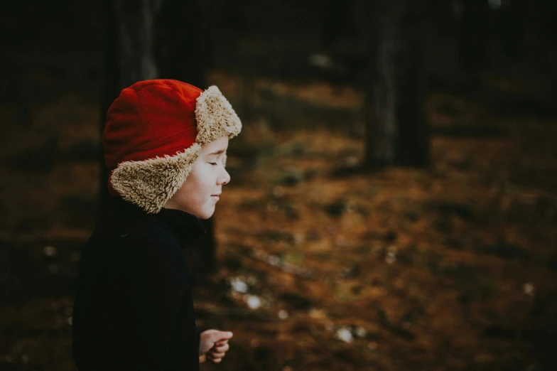 a  with a knitted hat looking away