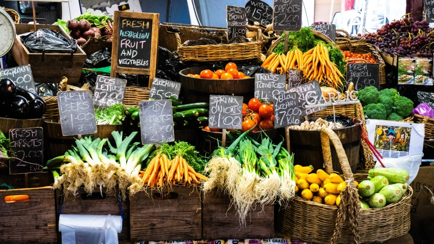 several baskets filled with various vegetables and fruits