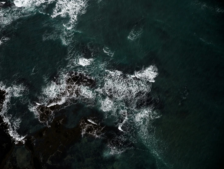 the view of the ocean from above as it reflects in the water