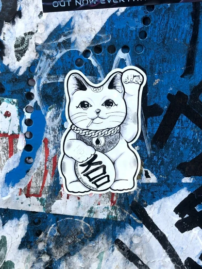 a picture of a cat on some graffiti