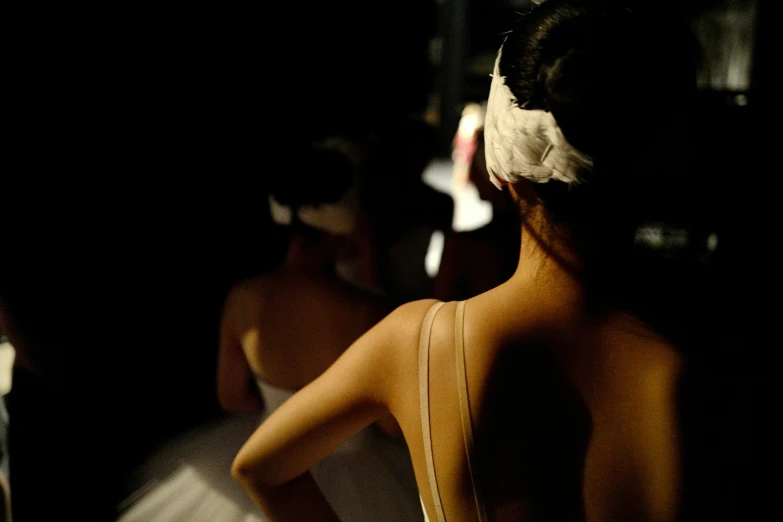 woman standing in front of mirror wearing her hair in pigtails