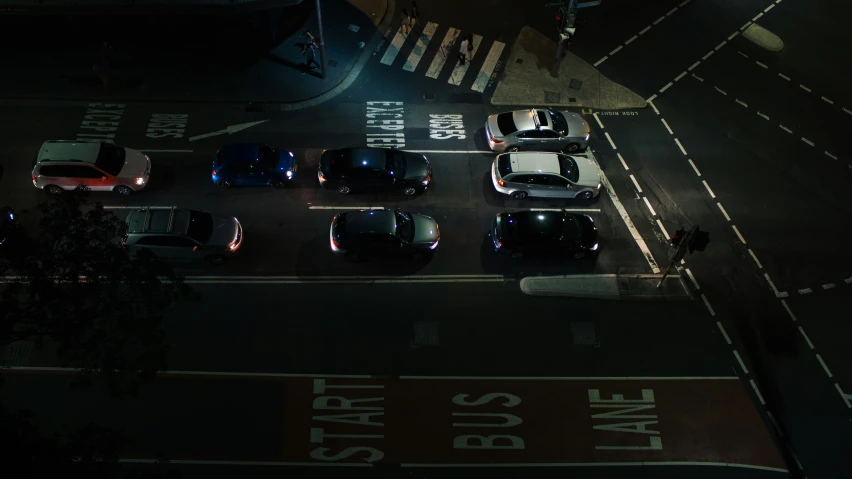 a group of cars sitting on top of a parking lot