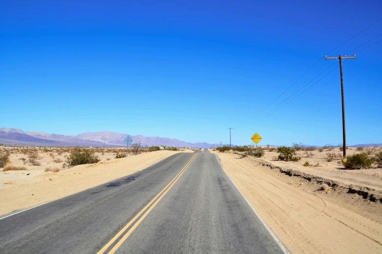 a long highway running through the desert
