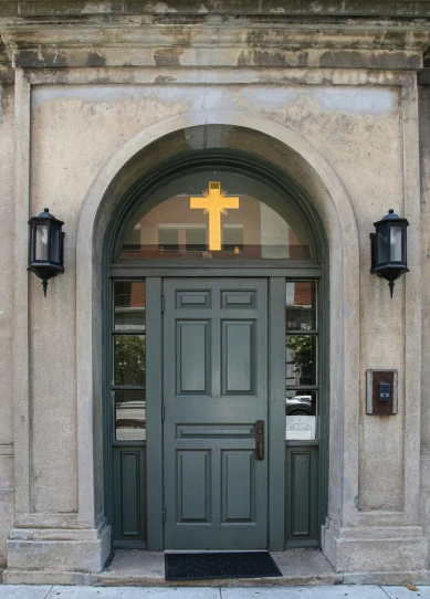 a cross on the door to a church