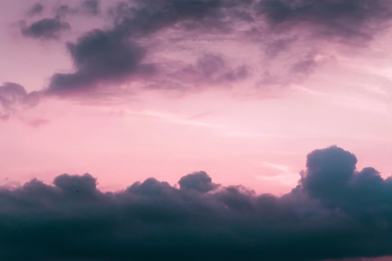 large clouds fill the sky with dusk color