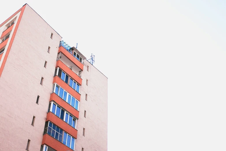 a tall building with a red and blue facade