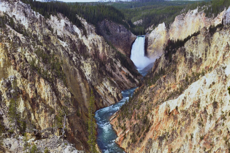 yellowstone national park the grand canyons where one can see a waterfall