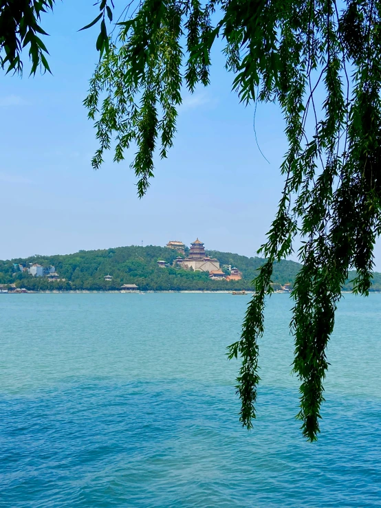 an island is seen in the background on a lake