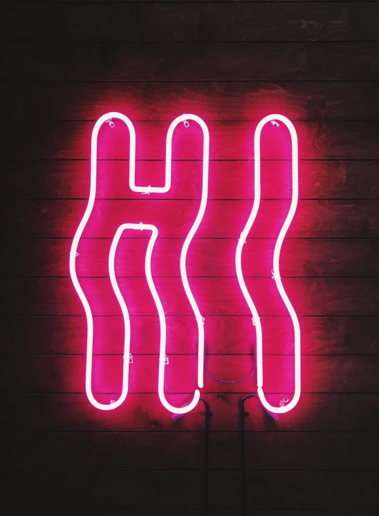 pink neon sign for a sports bar that is on display