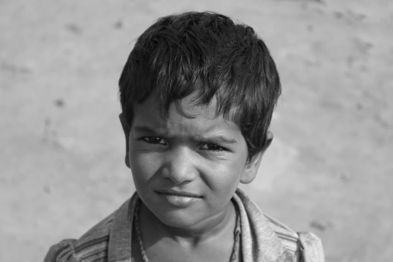 a black and white picture of a child's face