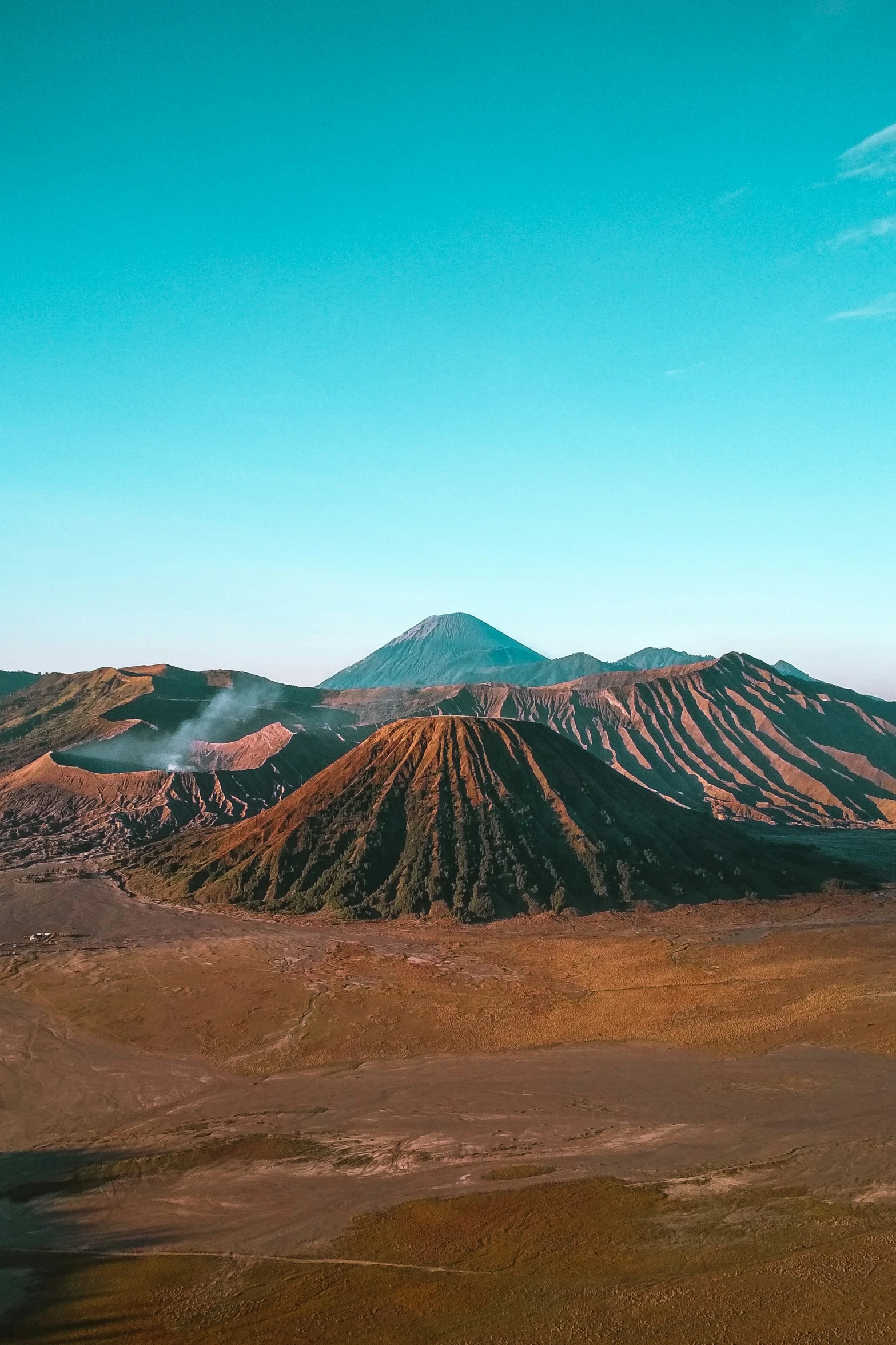 a mountain range with many hills and a sky line