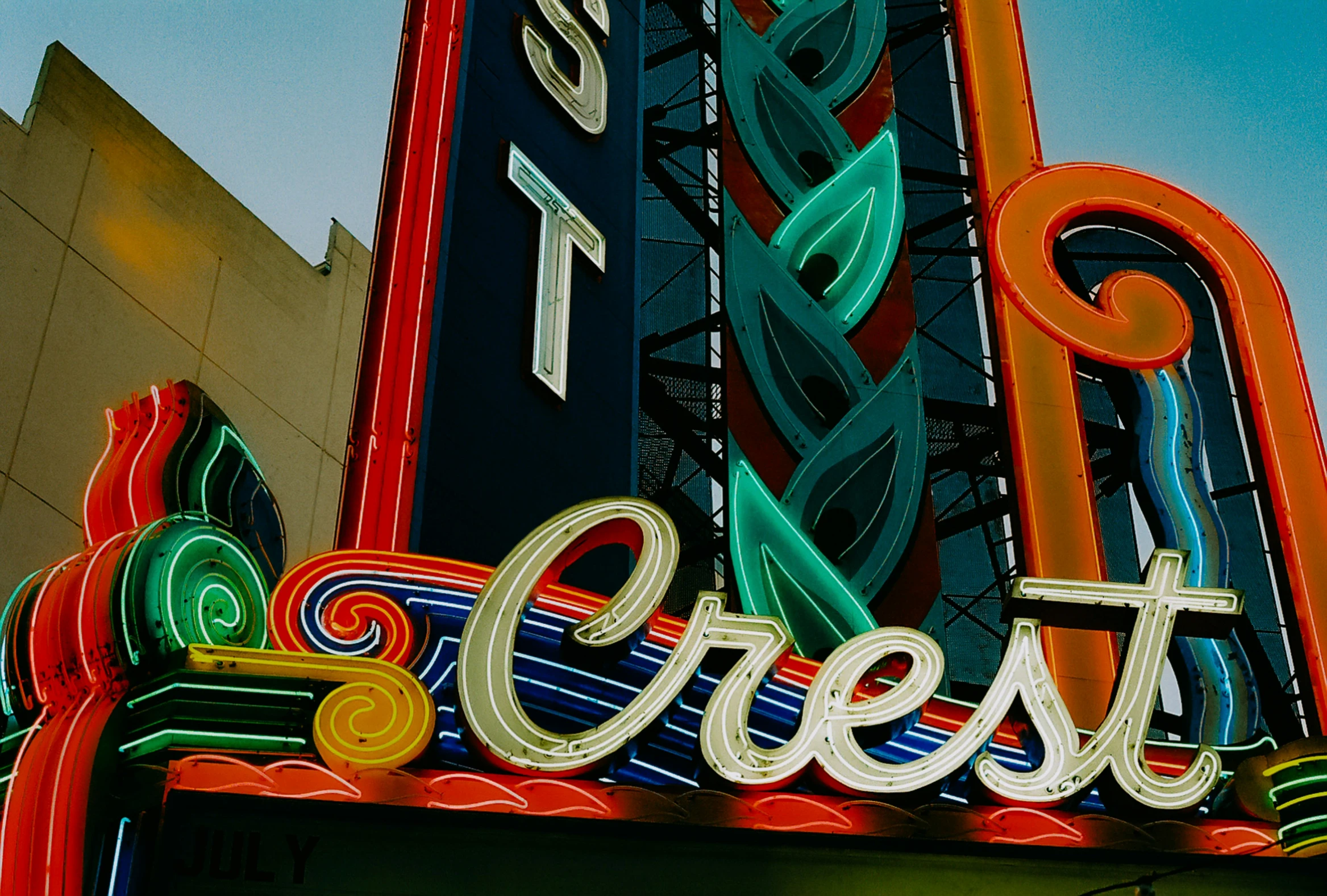 colorful neon sign for a casino called crest