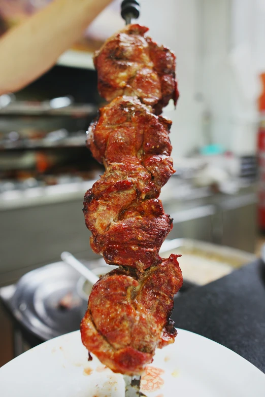 some kind of meat skewer with red sauce