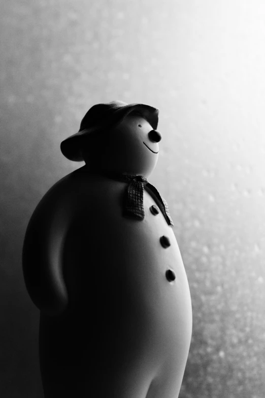 black and white po of small toy snowman