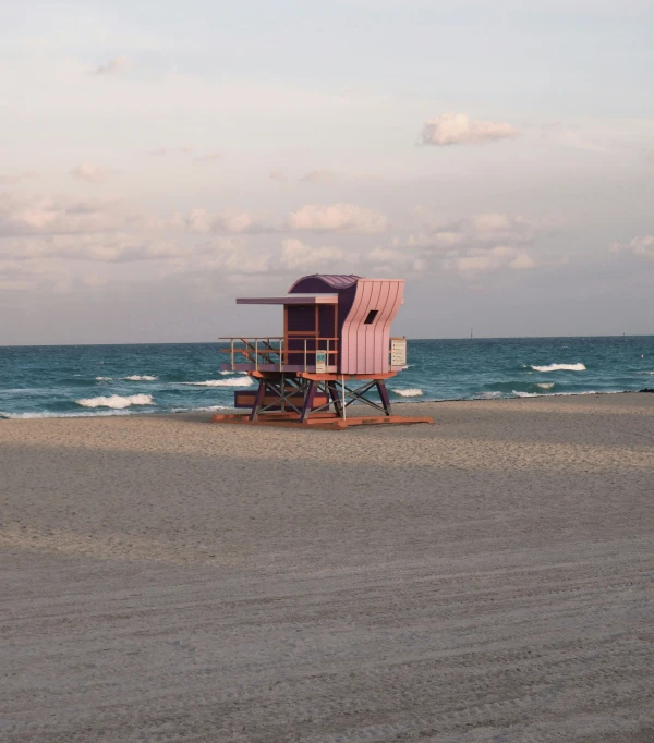 a lifeguard station is shown in the background on the beach