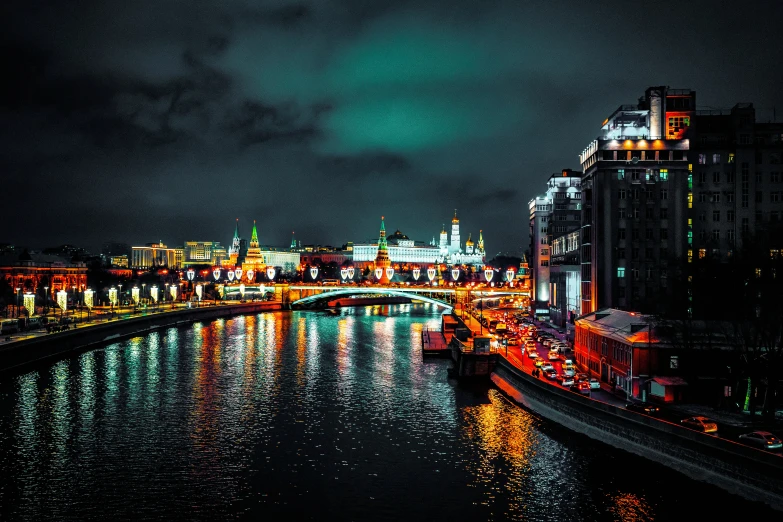 a waterway in front of a city at night with lights