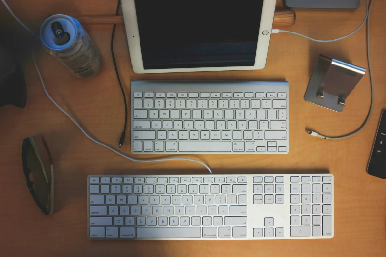 a desk with a keyboard, mouse and a monitor