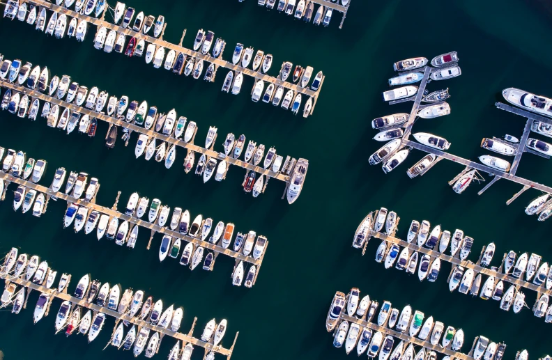 a group of boats sitting on top of a lake