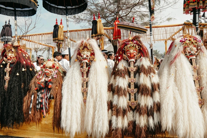 a number of people wearing colorful costumes near one another