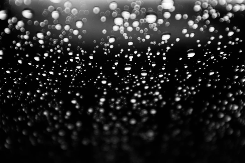 the inside of a glass with drops of water